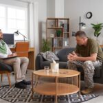 Male,Psychologist,Working,With,Mature,Soldier,In,Office