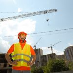 Young man civil engineer in safety hat