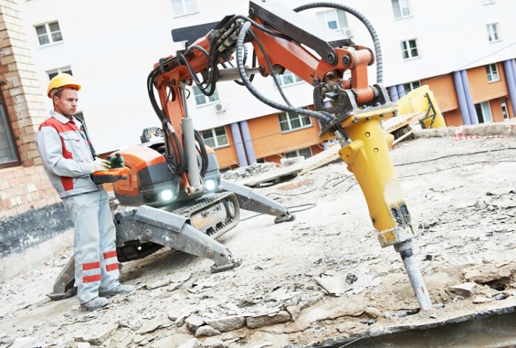 Professional asbestos inspector examining a residential property for asbestos safety
