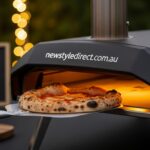 Portable pizza oven being used for home pizza making in an outdoor kitchen setting