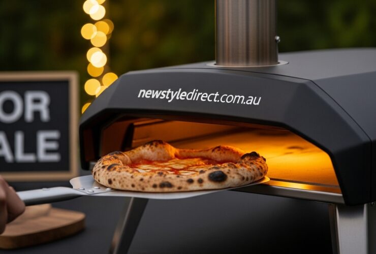 Portable pizza oven being used for home pizza making in an outdoor kitchen setting
