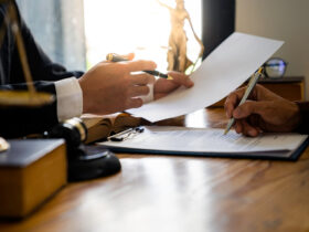 Book cover of In Pursuit of Justice: Chronicles of a Criminal Lawyer showing a courtroom scene with a lawyer in focus