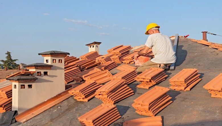 Professional roof restoration service repairing and repainting residential roof tiles