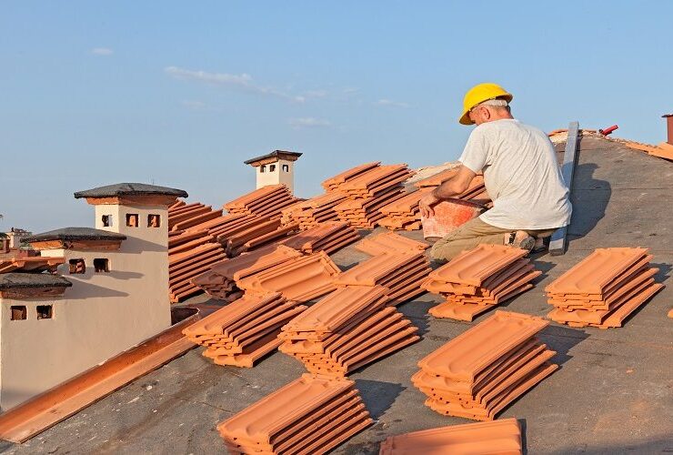 Professional roof replacement service installing new roofing materials on a residential home